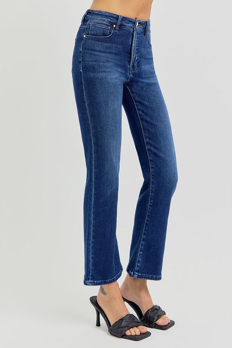 Blue jeans worn by a person on a white background