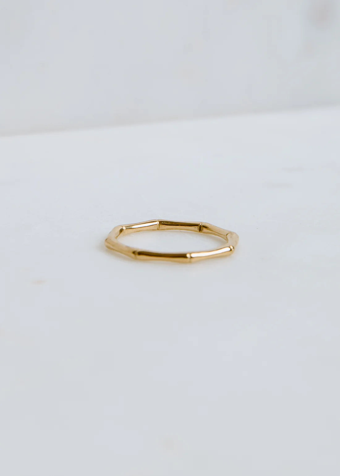 Gold ring on a white background