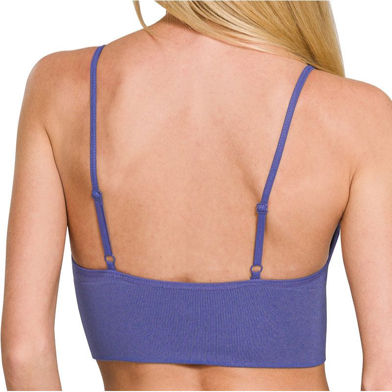 Purple bra with removable pads worn by a model on a white background