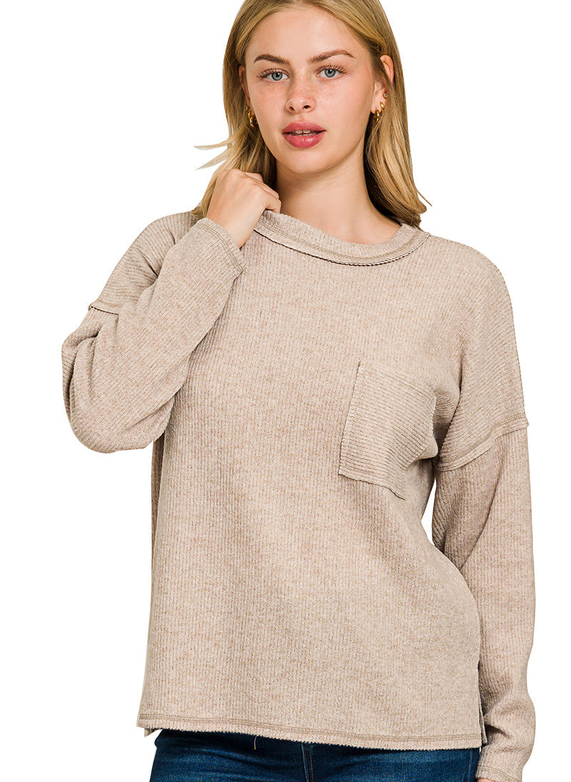 Woman wearing a latte sweater on a white background