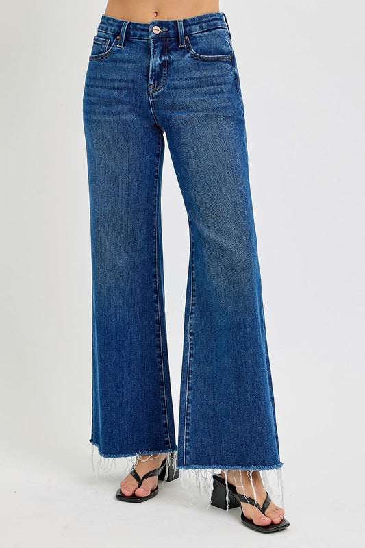 Risen Poppy Dark Blue jeans with black sandals on a white background