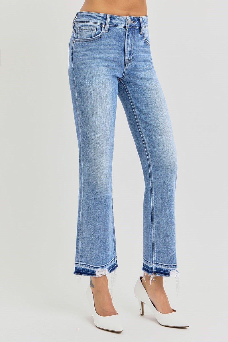 Blue jeans, High rise straight leg with raw, shadow-detailed hem worn by a person on a white background
